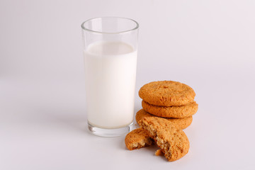 Oatmeal cookies and a glass of fresh milk. Still life of milk and cookies. Glass of milk and cookies on a white background.
