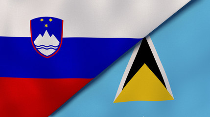 The flags of Slovenia and Saint Lucia. News, reportage, business background. 3d illustration