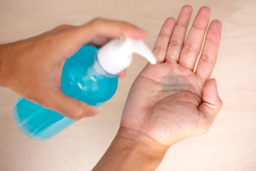 using hand sanitizer gel cleaning hands at home