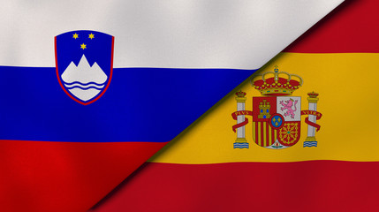 Obraz premium The flags of Slovenia and Spain. News, reportage, business background. 3d illustration