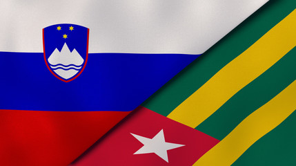 Naklejka premium The flags of Slovenia and Togo. News, reportage, business background. 3d illustration