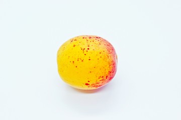 Beautiful delicious ripe apricot perched on a white background