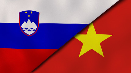 The flags of Slovenia and Vietnam. News, reportage, business background. 3d illustration