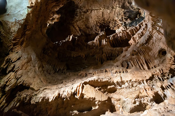Stalactites, stalagmites and streak formations in cave of Balzarca. Moravian Karst. Czech Republic