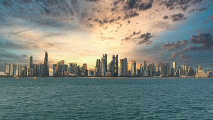 Doha, Qatar - February 2019: Doha Qatar skyline cityscape with skyscrapers under dramatic clouds