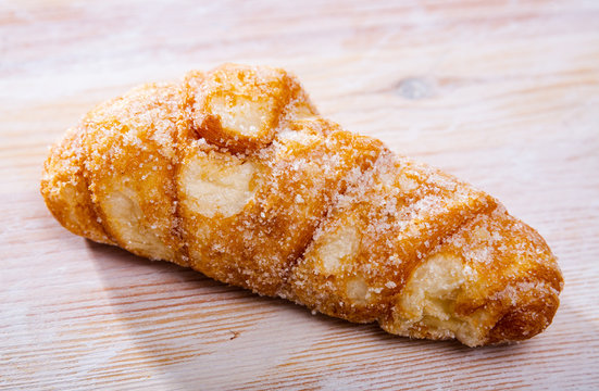 Catalan sweet bun with icing and sugar. Spanish dish