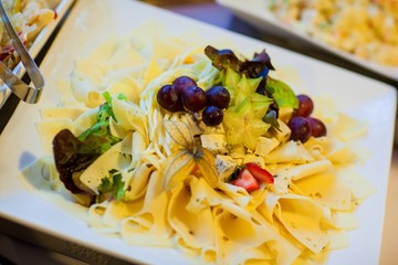 Food and drink at the restaurant. Table setting. Tasting dishes.
Set of cold snacks, canape, beverages, closeup  parte meals
Meals set for holiday, event, party or reception in outdoor restaurant.