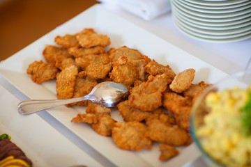 Food and drink at the restaurant. Table setting. Tasting dishes.
Set of cold snacks, canape, beverages, closeup  parte meals
Meals set for holiday, event, party or reception in outdoor restaurant.