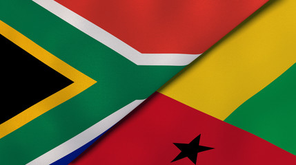 The flags of South Africa and Guinea Bissau. News, reportage, business background. 3d illustration