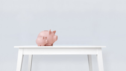Piggy bank on white table