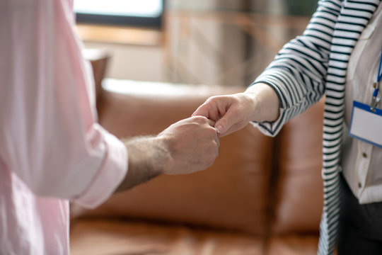 Close up picture of mans and femals hands