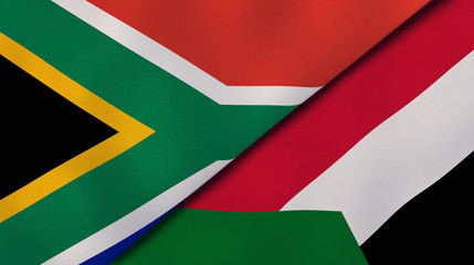 The flags of South Africa and Sudan. News, reportage, business background. 3d illustration