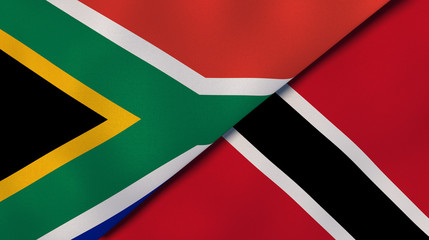 The flags of South Africa and Trinidad and Tobago. News, reportage, business background. 3d illustration