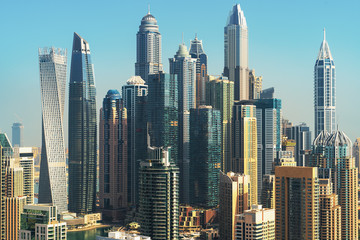 Fototapeta na wymiar Modern Tower buildings, Dubai city skyline with skyscrapers, UAE.