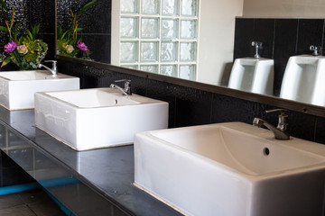 Public sinks, Handwashers for people using public toilets, Public toilets and hygiene concept.