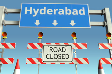 Obraz premium Roadblock near Hyderabad city road sign. Coronavirus disease quarantine or lockdown in India conceptual 3D rendering