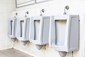 Men's white urinals design, Close up row of outdoor urinals men public toilet, Urinal concept.