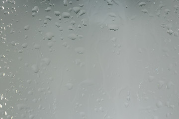 wet glass background condensate / abstract rain, drops texture on transparent glass