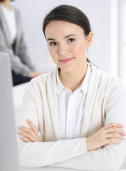 Casual dressed business woman working with computer in office. Lawyer or accountant at work