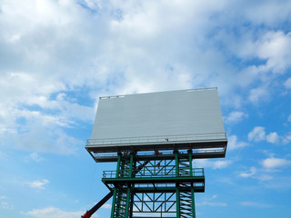 Man Working on the Working at height on construction site with blue sky