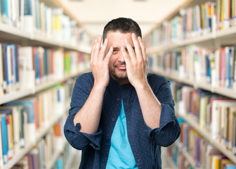 Young man wearing a blue outfit.