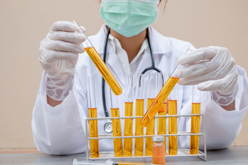 Professional doctors perform testing and analyzing samples of COVID-19 vaccines for immunization prevention and treatment from viral infections. Medical and health care concepts