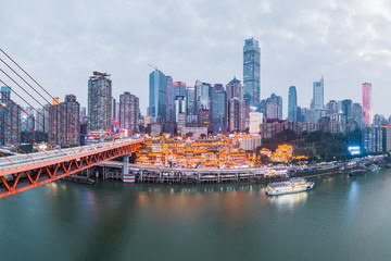 Naklejka premium Aerial drone shot of Hong Ya Dong cave by Jialing river in Chongqing, southwest China