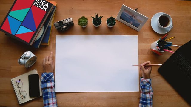 4K. creative professionals are using ideas for jobs that require creativity, tap the finger and rotate the pencil while out of ideas, top view 