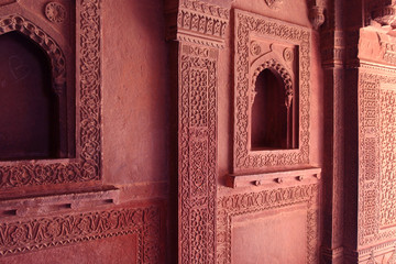 Carved indian red walls of Fatefpur Sikri Palace - UNESCO Wolrd heritage site from 16th century
