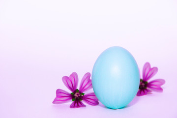 Fototapeta na wymiar festive Easter egg light blue and pink flowers