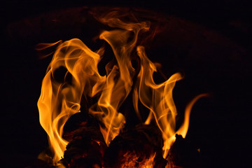Fiery figures. Fire flames on black background
