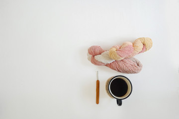 coffee and yarns ball on white background