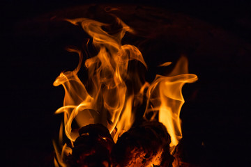 Fiery figures. Fire flames on black background