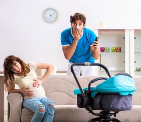 Obraz premium Young parents with baby expecting new arrival