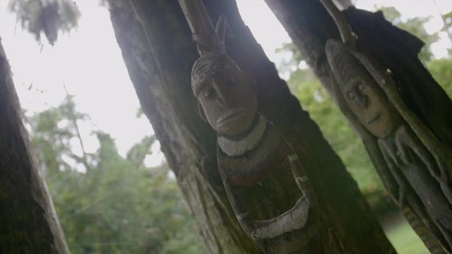 Spooky rotating dolly of voodoo carved wood doll in village in Papua New Guinea
