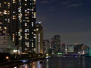 Fototapeta na wymiar High rise buildings in Tokyo reflected in a river