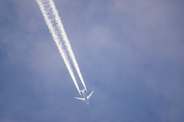 Aeroplane vapor trails in jet stream from jet aircraft.