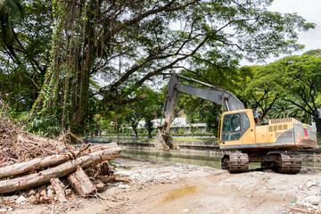 Excavator destroys nature and trees in Kuala Lumpur, Malaysia.
