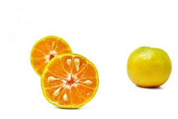 Orange cut in half on white