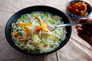 Korean chicken noolde soup which is called Dalgkalgugsu