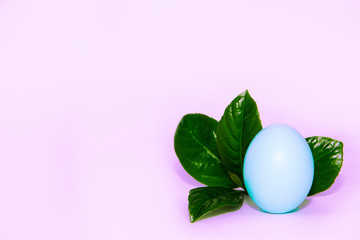 festive Easter egg light blue and green leaves