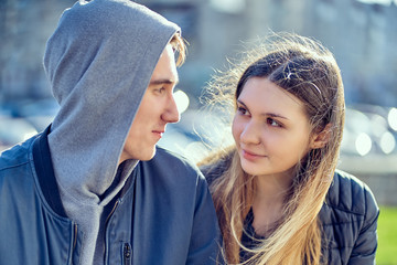 Close-up of a couple in love. girl looks at a guy