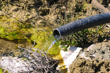 a fountain in the land, a fountain that has just started to be built,