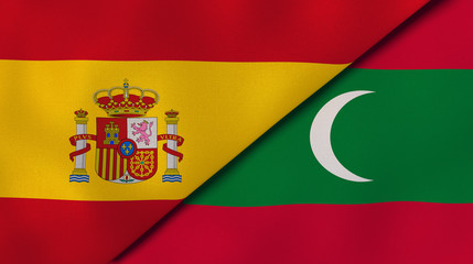 The flags of Spain and Maldives. News, reportage, business background. 3d illustration