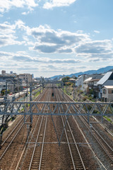 straight train tracks with sky background