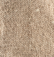 fragment of knitted fabric from light brown wool of a sheep