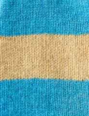 fragment of knitted fabric from blue and beige wool