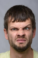 Fototapeta premium Close-up portrait of a man funny frowning eyebrow of European appearance