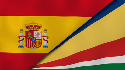 The flags of Spain and Seychelles. News, reportage, business background. 3d illustration
