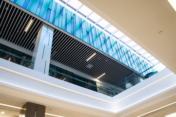 Beautiful architecture with a glass emerald roof in an empty shopping center. Moscow, Russia - April 14 2020